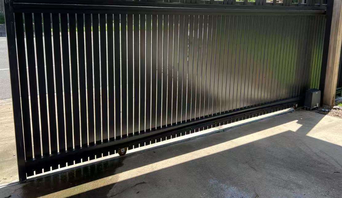 Matt black aluminium picket gate and fence in Brisbane